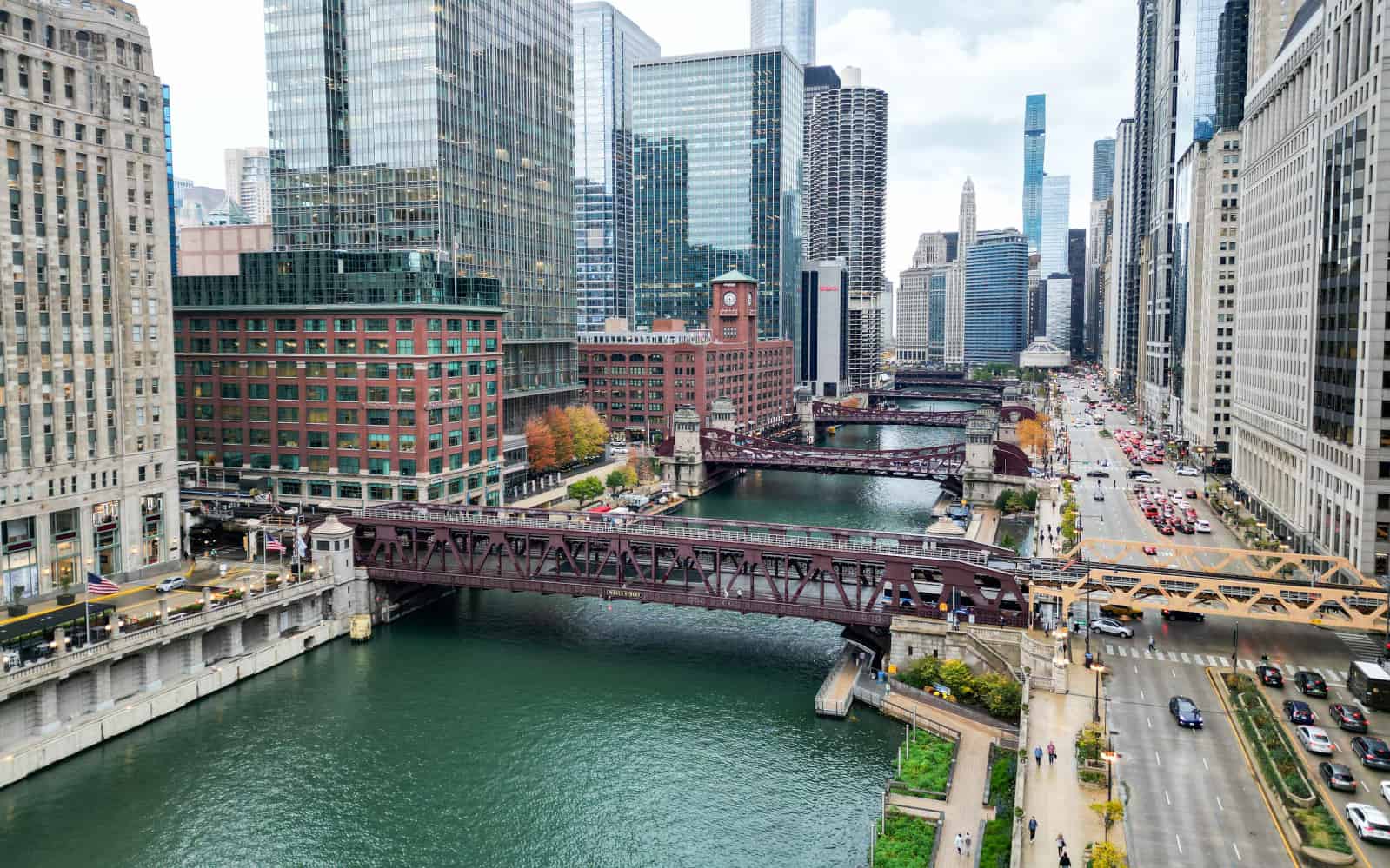 Overhead view of Chicago River and its bridges and neighboring skyscrapers looking east, with Wells Street Bridge centered