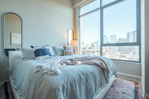 Bedroom with high ceilings at Chicago's Union West apartments