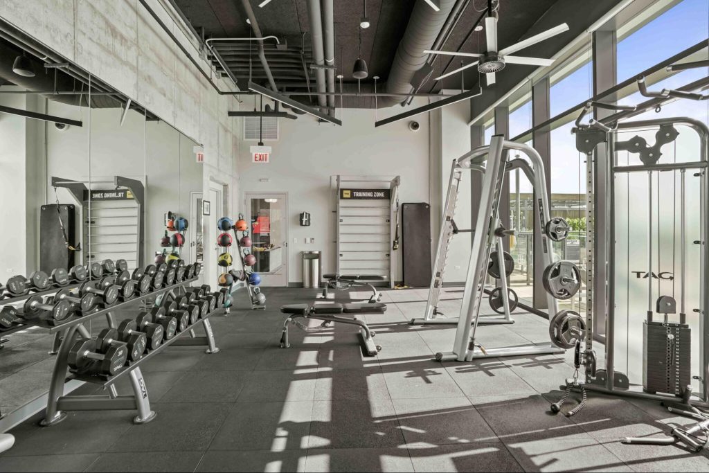 A look at the sunlight-filled fitness center at Aspire Apartments in Chicago's South Loop