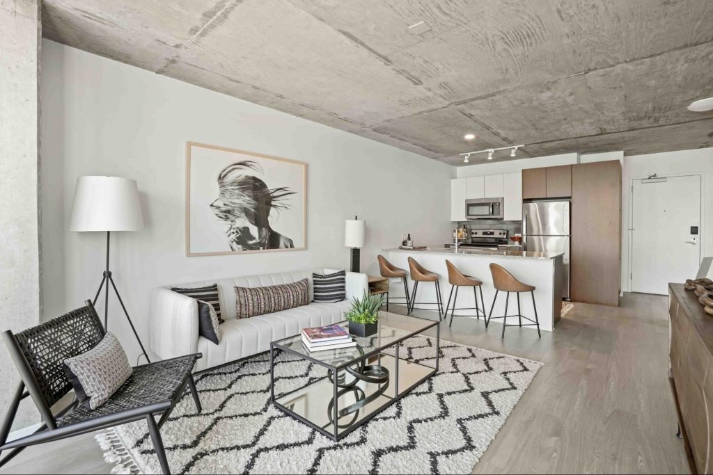 Modern, industrial style apartments at Aspire in Chicago with concrete ceilings and gray and white details.