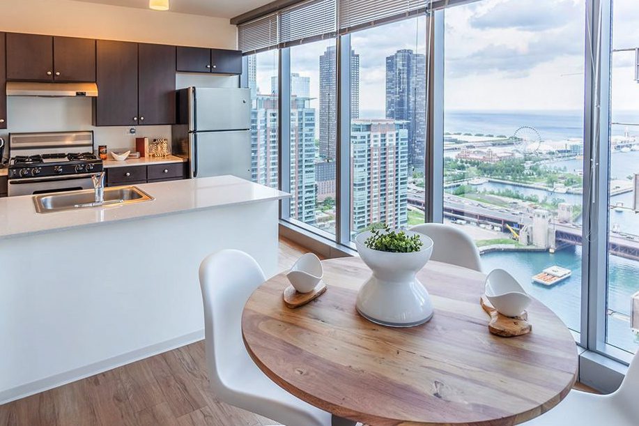 A view of the lake and Navy Pier from a living room at Coast luxury apartments in Lakeshore East