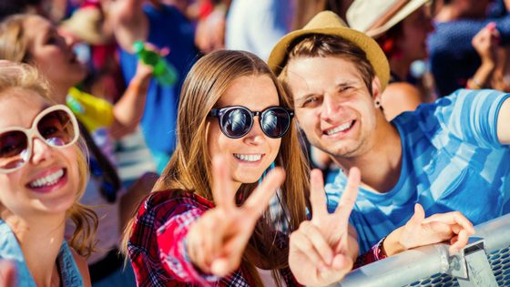 Friends Smiling at Music Festival