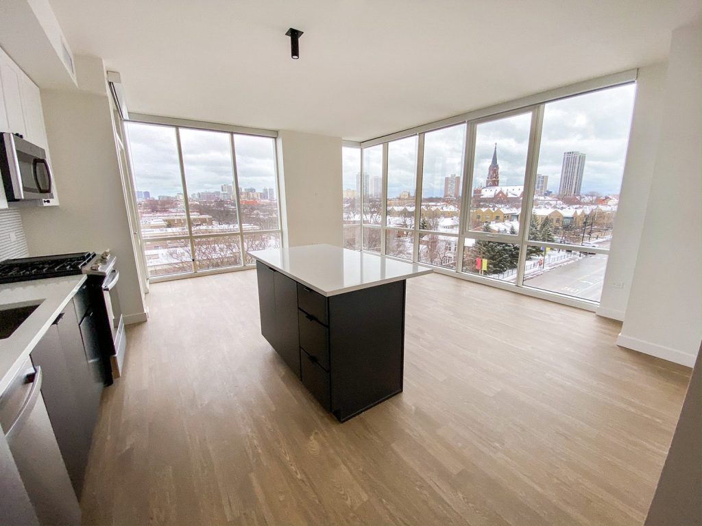 An open concept view of the kitchen and living space at North and Vine apartments in Chicago's Old Town neighborhood. 