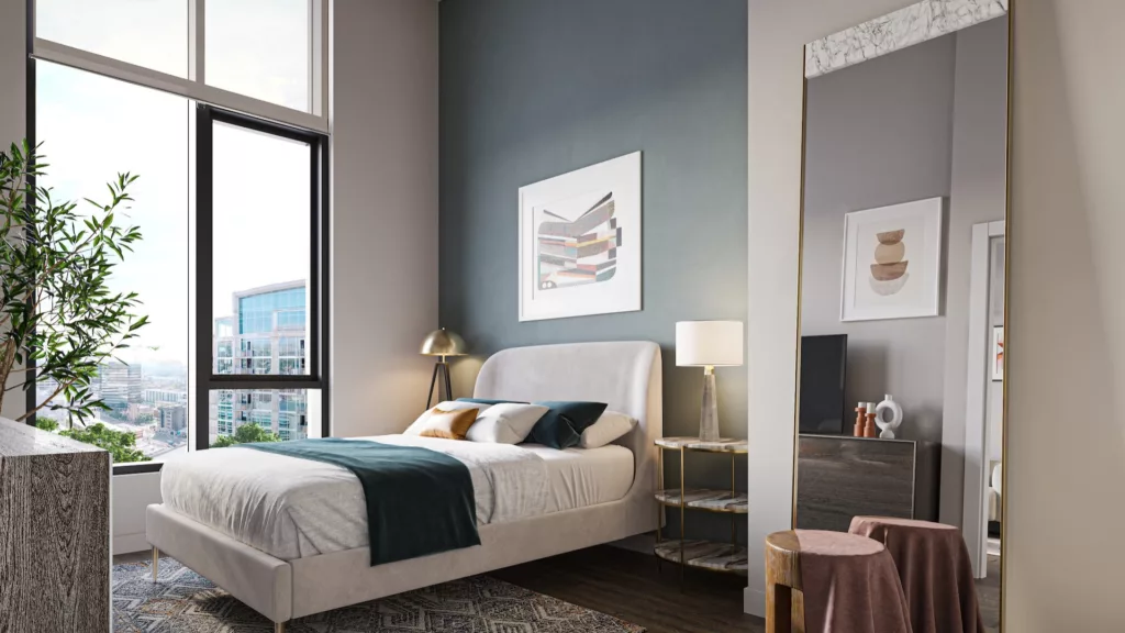 An image of a beautiful bedroom, complete with floor to ceiling windows, at One Six Six luxury apartments in downtown Chicago. 