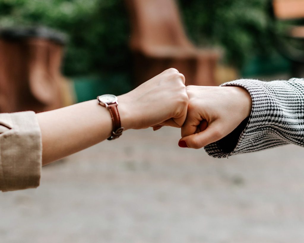 A fist bump at the end of a deal made