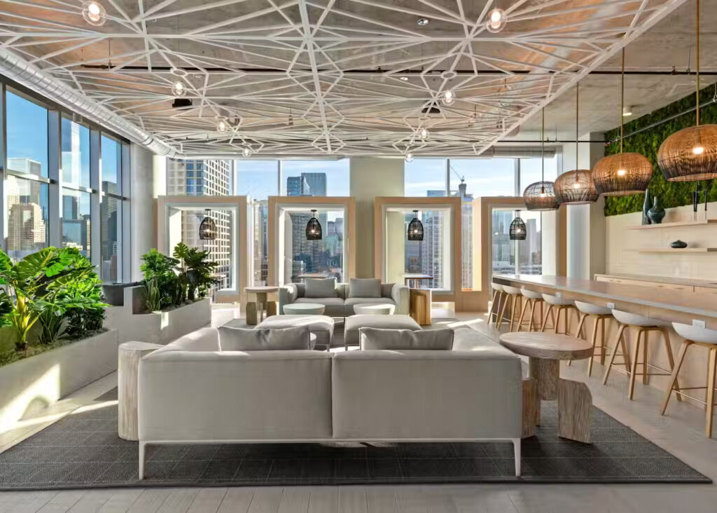 Furnished co-working lounge with skyline views at Chicago luxury apartment building Amli 808