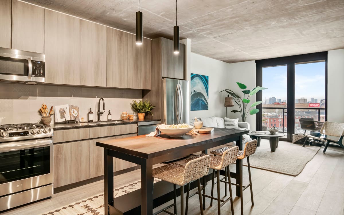 Modern, open concept furnished kitchen and living area at Chicago's Evo Union Park luxury apartments